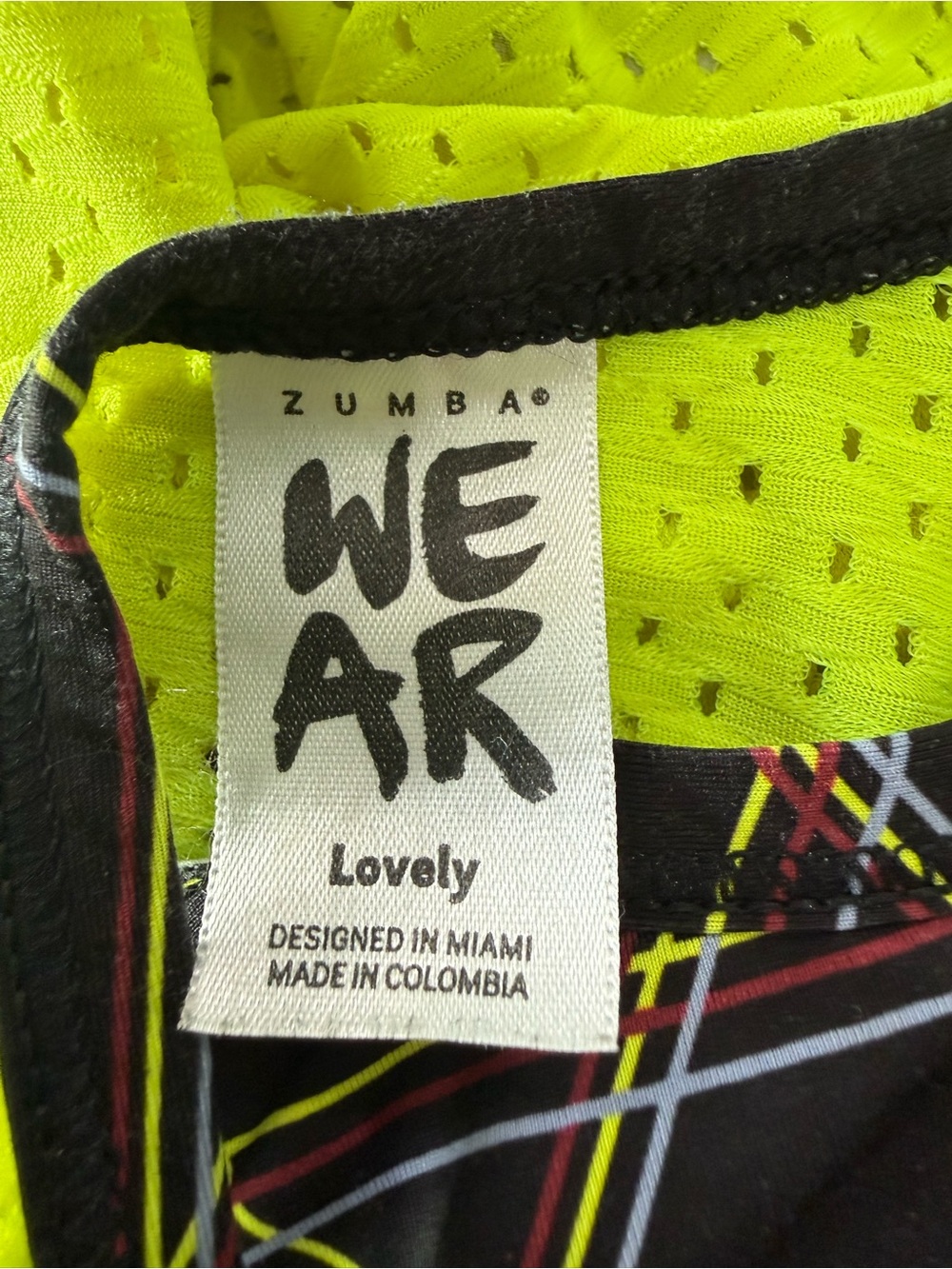 Zumba Fitness Neon Yellow Mesh Top with Black Trim and Multicolor Stripe Detail - Picture 13 of 13